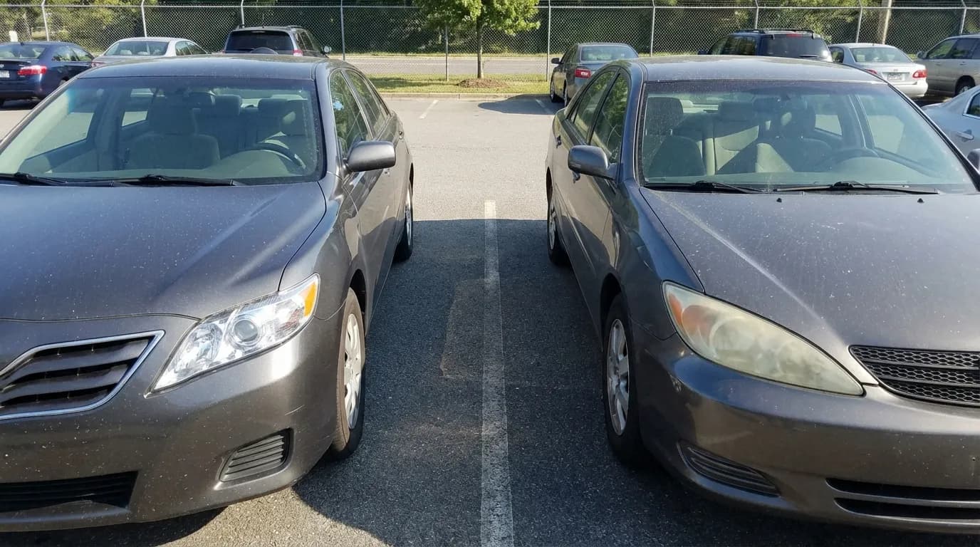 Two grey cars side by side