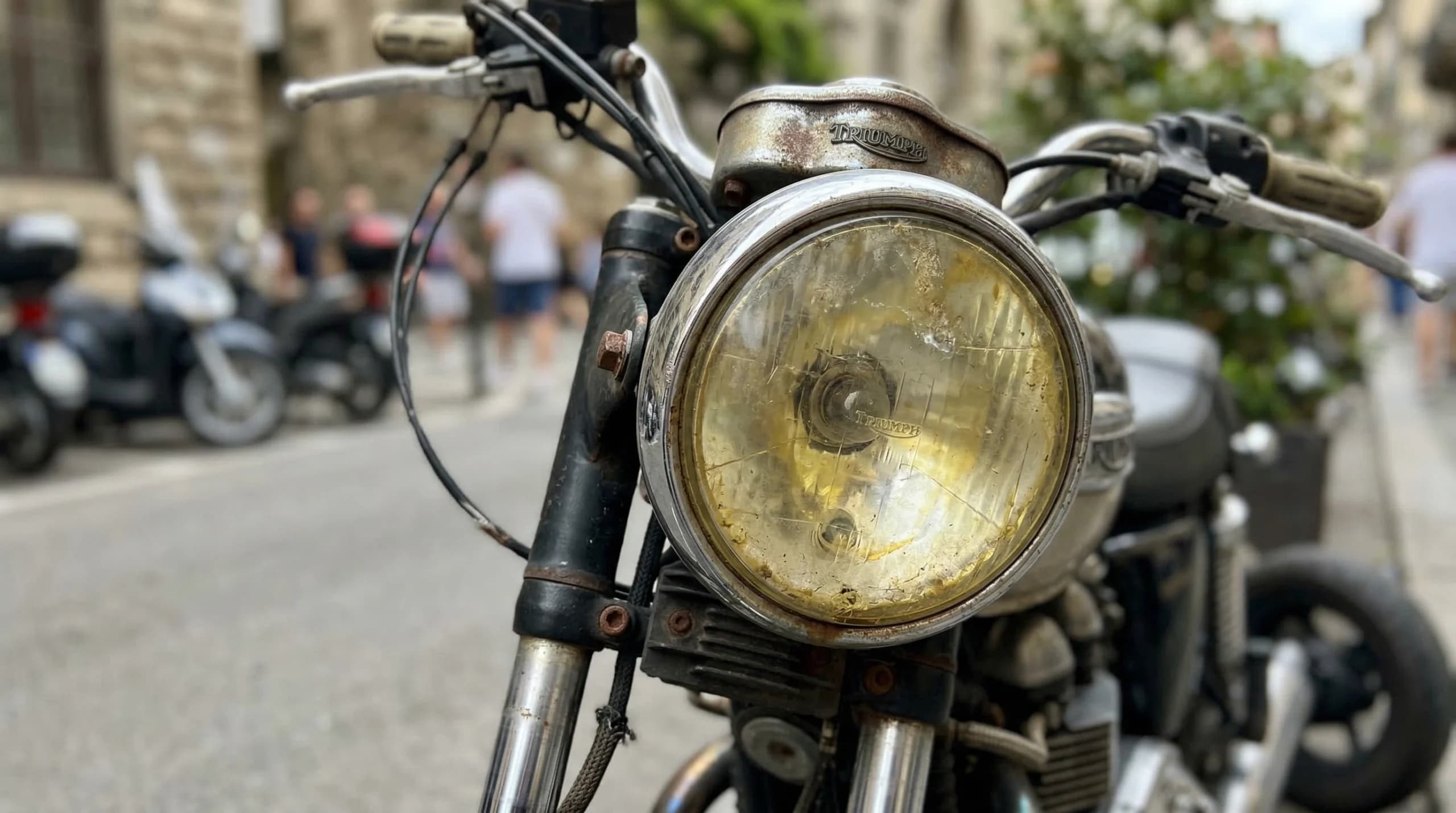 Vintage motorcycle with rusty headlight