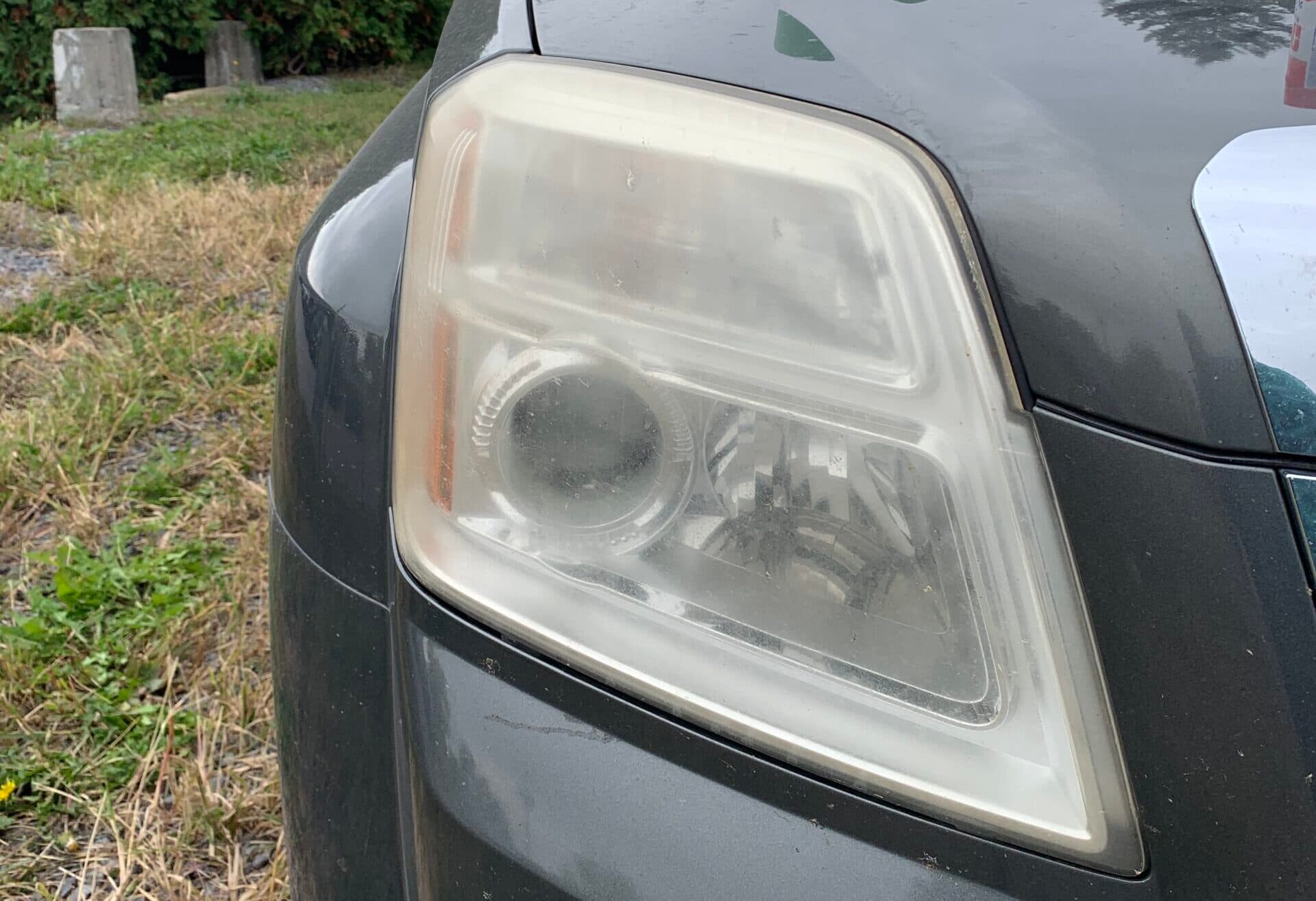 Cloudy and yellowed headlight before restoration
